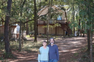 Karen & Mitch in front of homestead